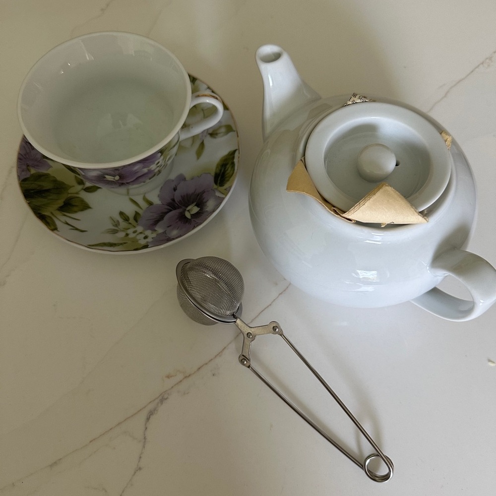 Teapot small white porcelain teapot and purple Rose teacup with strainer